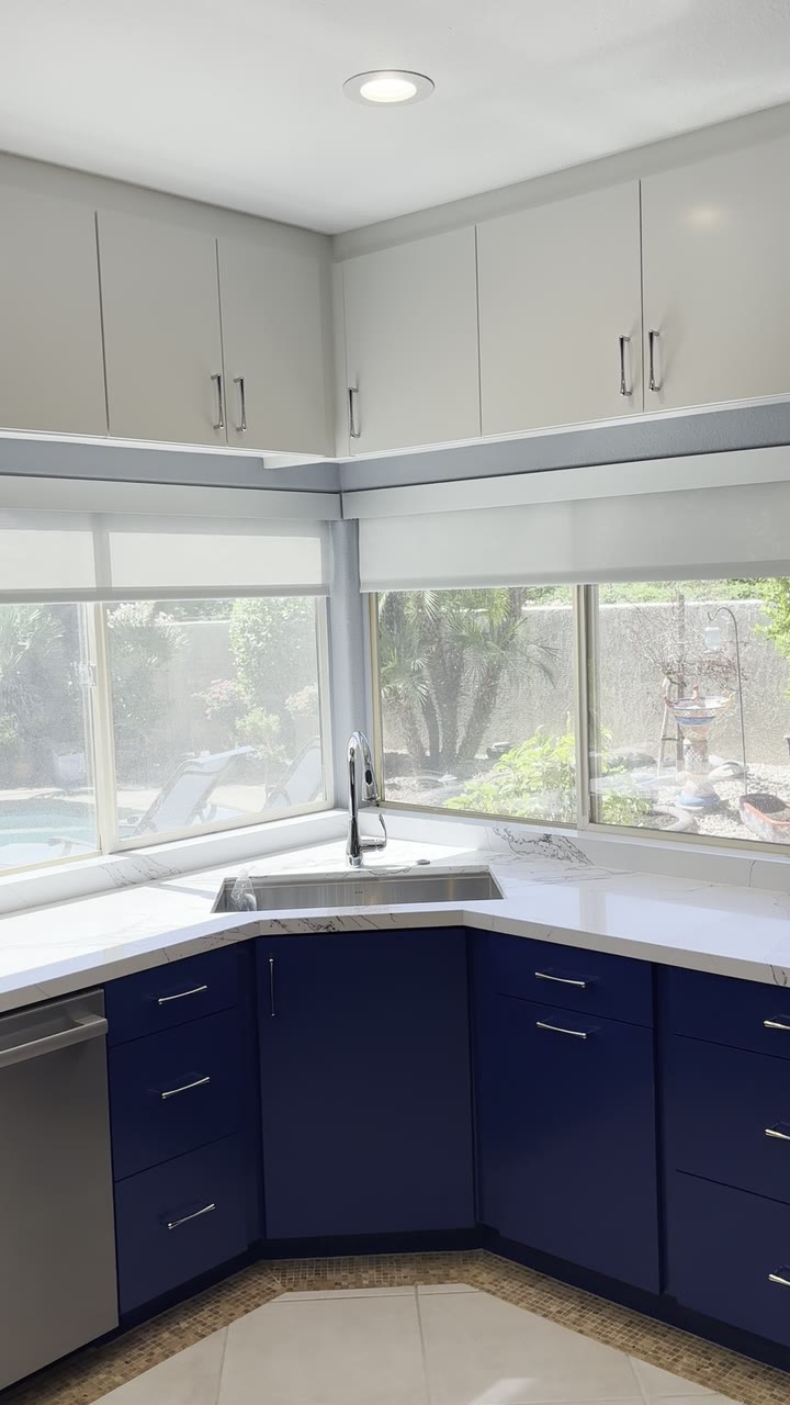 Custom roller shades installed in a bright Coachella Valley kitchen